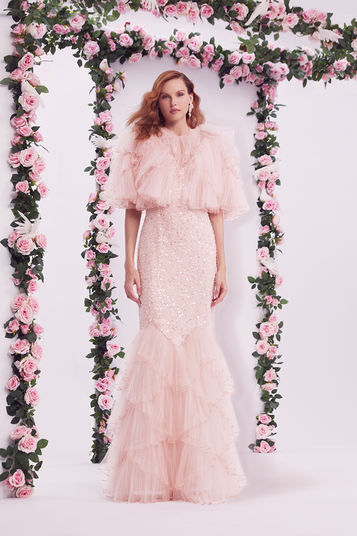 ANTIQUE PINK PEARL AND CRYSTAL BEADED CRYSTAL PLEATED TULLE MERMAID GOWN WITH ANGLED RUFFLES PAIRED WITH MATCHING CRYSTAL PLEATED TULLE WITH ANGLED RUFFLE BOLERO