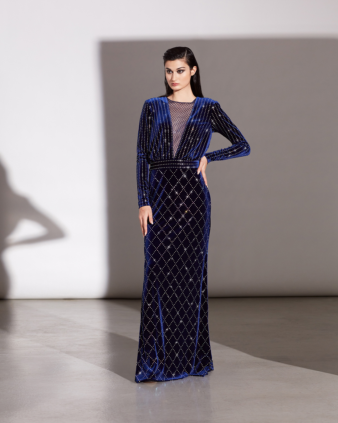MARINA BLUE IRIDESCENT DIAMANTÉ STRETCH VELVET V-PLUNGE ILLUSION LONG SLEEVE GOWN