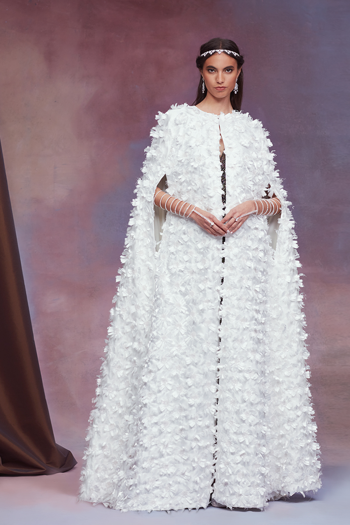 IVORY BARONET SATIN FLOWER FLOOR-LENGTH CAPE WORN OVER  BLACK/NUDE DIAMANTE TULLE V-NECK DRAPED GOWN WITH FRONT SLIT